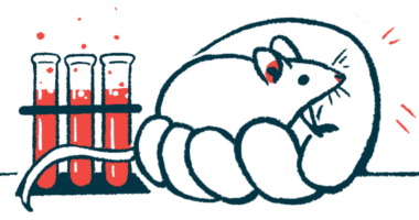 An oversized human hand holds a mouse next to rack of filled test tubes in a lab.