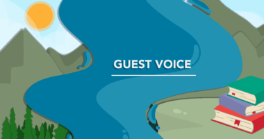 An oversized human hand holds a mouse next to rack of filled test tubes in a lab.